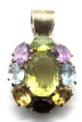 A hallmarked silver and multi colour stone pendant 40mm in length.