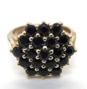 A silver cluster ring size L/M.