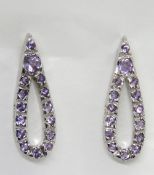 A pair of silver and purple stone eardrop stud earrings, stamped 925, approx 22mm drop.