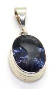 A large blue quartz pendant set in silver, stamped 925, 36mm inc bale.