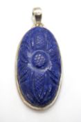 A large and impressive carved lapis lazuli pendant, set in 925 silver mount, 55mm inc bale.