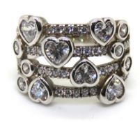 A silver and white stone heart design ring, stamped 925, size L.