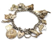 A substantial silver charm bracelet, various marks upon, 57.