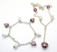 A silver and foiled glass suite comprising necklace and bracelet, both stamped 925.