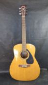 A Yamaha F-310 acoustic guitar
