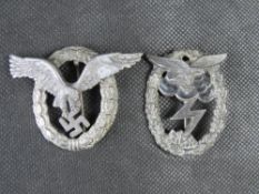 A pair of reproduction WWII German badges being Luftwaffe Pilots and Ground Assault.