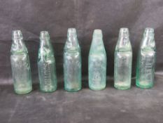 Six Codd bottles with marbles.