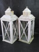 A pair of large glazed lanterns, each standing 60cm high.