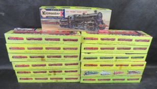 A quantity of Kitmaster scale model railway carriages and locomotive kits.