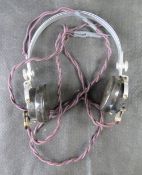 A WWII period radio headset with cable.