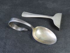 A hallmarked silver baby spoon and sterling silver pusher. Total weight 35.7g / 1.