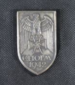 A reproduction WWII German Cholm sheild