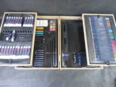 An artists box containing various watercolour and oil paints, pencils, etc.