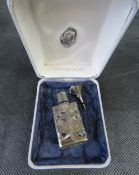 A sterling silver and glass perfume bottle in box.