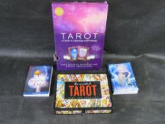 A quantity of tarot cards and instructional guides