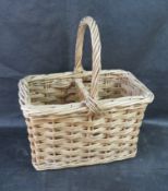 A wicker wine bottle basket