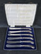 A set of six hallmarked silver handled butter knives, in box.