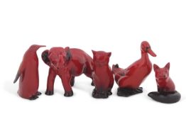 A group of Royal Doulton flambe animals including a flambe model of an elephant, a duck, a