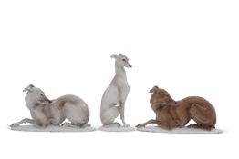 THREE ROSENTHAL PORCELAIN MODELS OF WHIPPETS/GREYHOUNDS, modelled by Theodor Karner, two recumbent