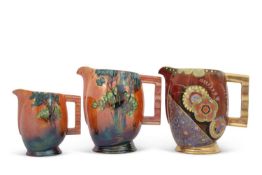 A mixed lot of three Carlton ware Art Deco style jugs all with Art Deco lustre style decoration,