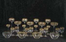 A suite of various drinking glasses all with gilded decoration in Baccarat style comprising hock