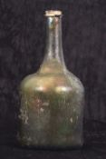 Mallet Shape Green Bottle 16/17th Century with some irridescense 23cm high 23cm high chip to rim