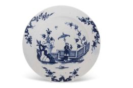 A rare Lowestoft plate decorated in blue and white with the lady and parasol pattern, indistinct