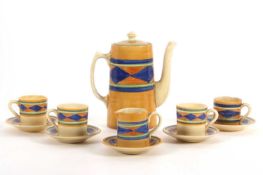 A Clarice Cliff part coffee set in an early geometric pattern comprising coffee pot, milk jug,