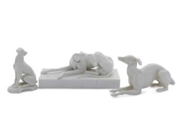 NYMPHENBURG MODELS OF ITALIAN GREYHOUNDS OR WHIPPETS, the first on shaped oval base impressed shield