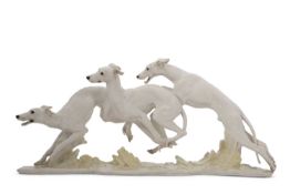 HUTSCHENREUTHER : A STUDY OF THREE WHIPPETS BY H. ACHTZIGER (1918-2003), mounted on a naturalisitc