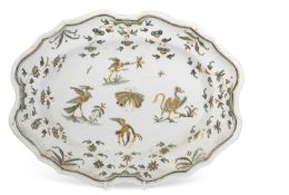 An 18th Century French faince dish probably Moustiers, of shaped form, decorated with exotic birds