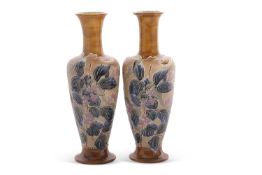A fine pair of Royal Doulton vases with tubelined floral decoration on Slaters patent ground with