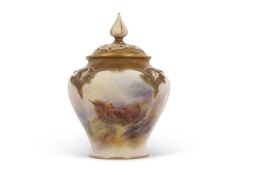 A Royal Worcester vase early 20th Century of small baluster form with pierced cover, the vase