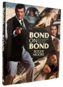 ROGER MOORE INSCRIBED: BOND ON BOND - THE ULTIMATE BOOK ON 50 YEARS OF BOND MOVIES, London,