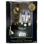 A boxed Star Wars electronic talking money bank, featuring C-3PO and R2-D2