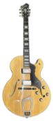 A Hagstrom HJ600 semi-acoustic guitar in lined and branded hardcase. Model number: M06090390