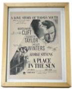 A framed advertisement for A Place in the Sun, starring Montogomery Cliff and Elizabeth Taylor