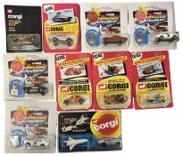 A collection of various die-cast James Bond cars, with reproduction card and bubble packs