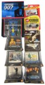 A collection of various die-cast James bond cars, including Corgi, Shell and Whizzwheels
