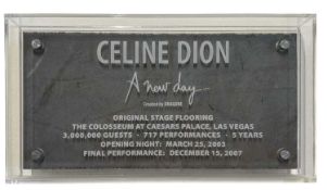 A perspex case containing a section of original stage flooring used during Celine Dion's 'A New Day'