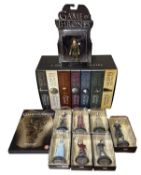 A collection of Game of Thrones memorabilia, to include boxed paperback book set, various
