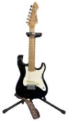 A children's Rockwood/Hohner LX30 electric guitar and stand