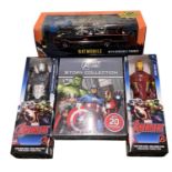 A collection of various boxed superhero memorabilia, to include Avengers action figures, story