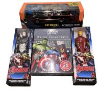 A collection of various boxed superhero memorabilia, to include Avengers action figures, story