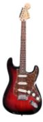 A Fender Squier stratocaster electric guitar in cherry sunburst. Serial number: ICS17140118