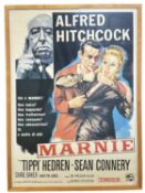 A framed italian reproduction one sheet poster for Alfred Hitchcock's Marnie, starring Tippie Hedren