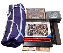 A mixed lot of various Harry Potter memorabilia, to include: - Sleeping bag - Jigsaw puzzle -