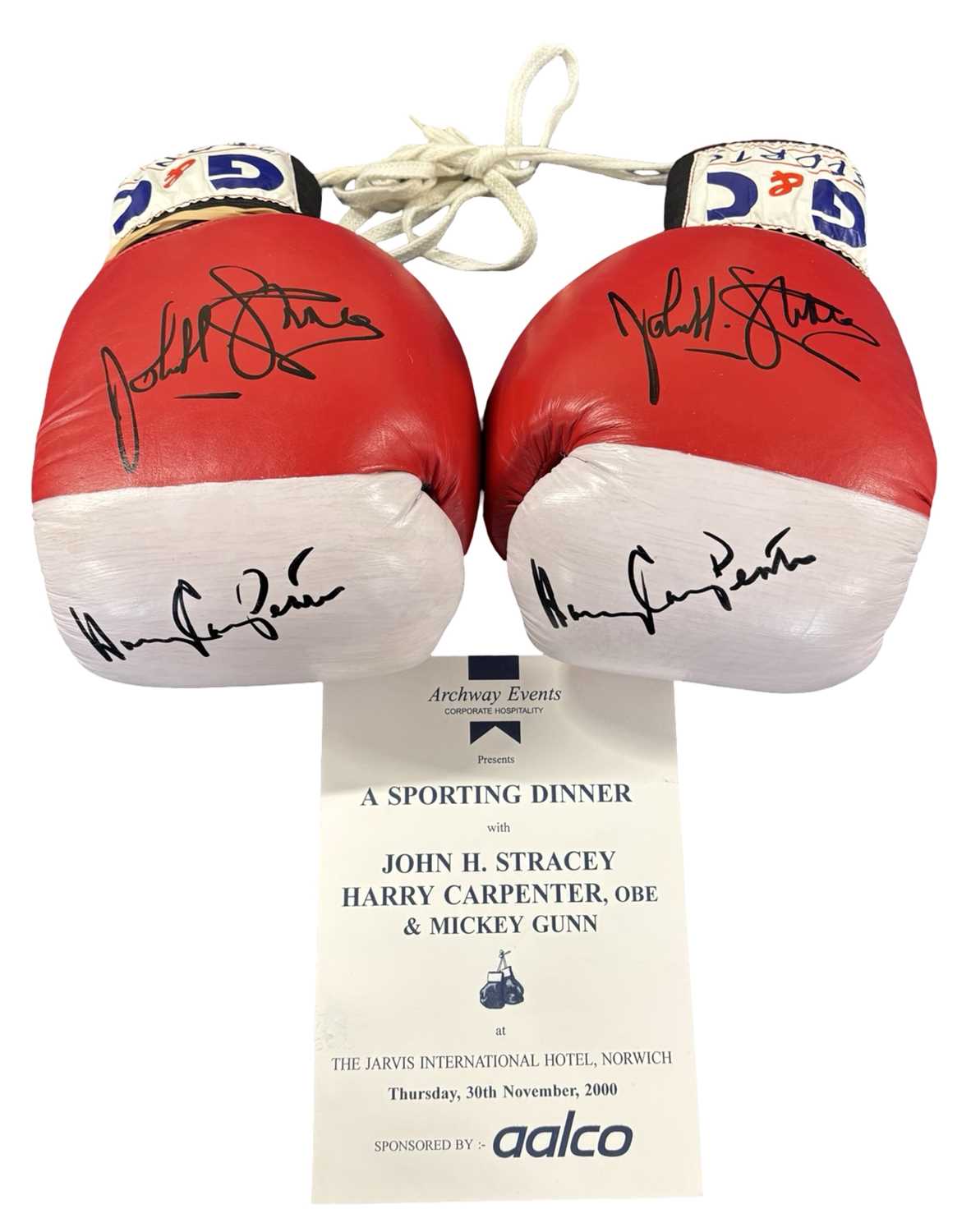 A pair of boxing gloves signed by Harry Carpenter and John Stracey, together with a programme signed