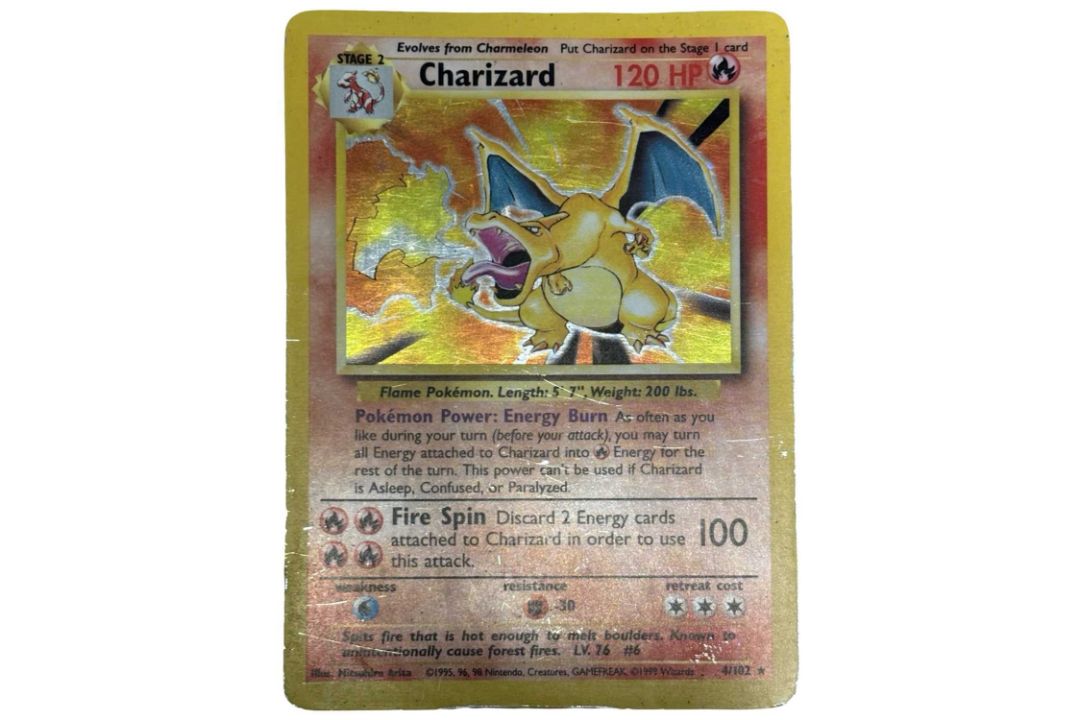POKEMON TCG 1999: First edition Charizard holographic, 4/102. Played, chipping to card edges and