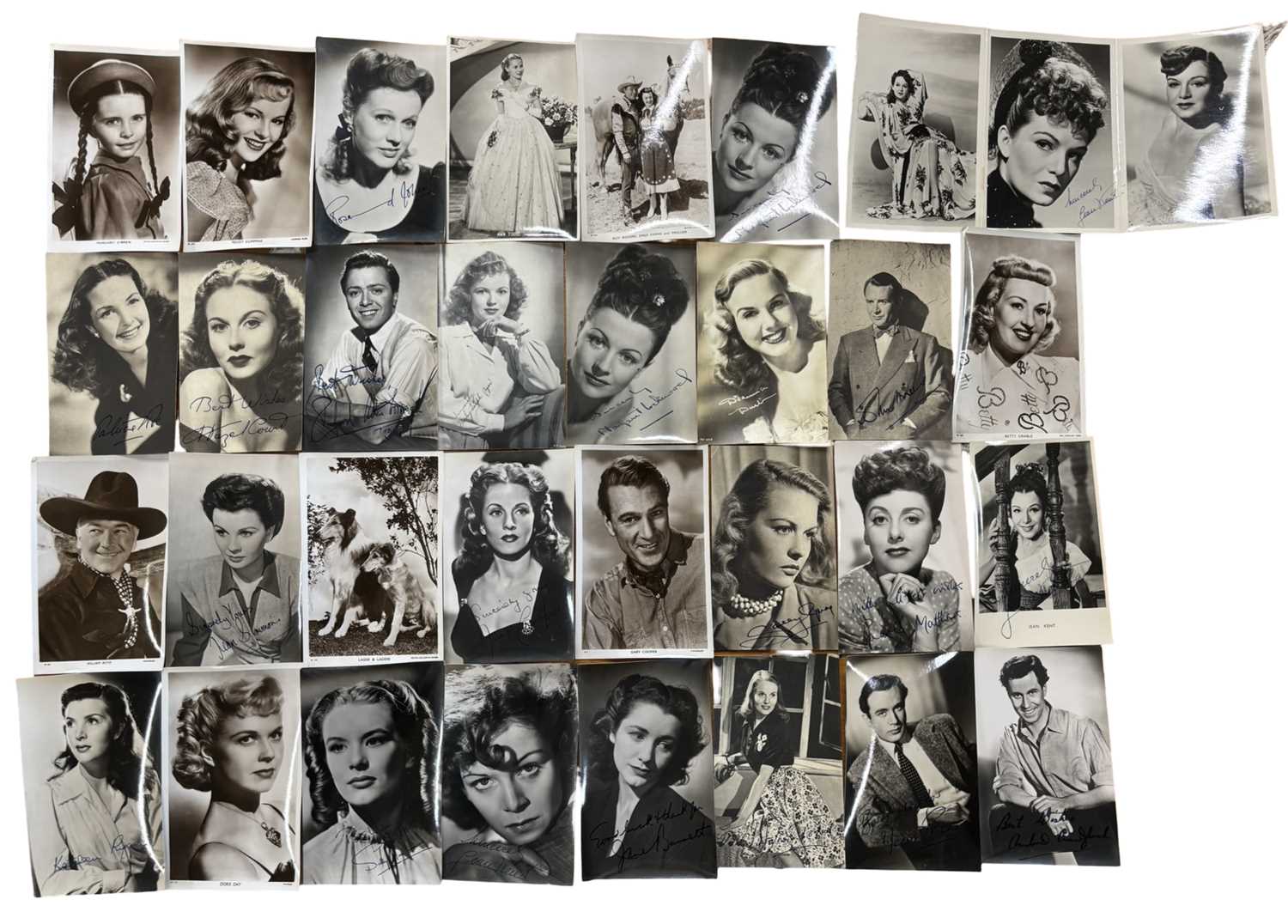 A collection of various black and white postcard fim stills and headshots, some bearing facsimile